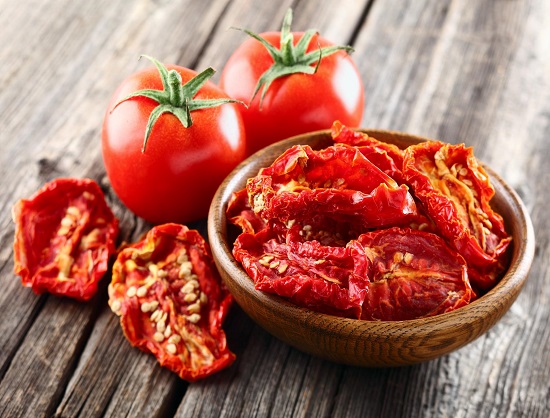 Tomato in a wooden background